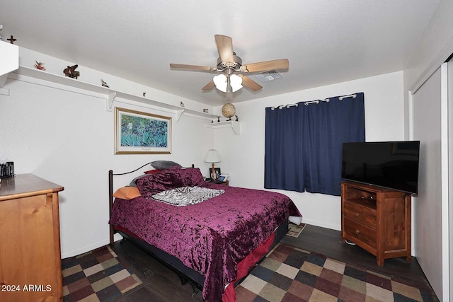 bedroom with ceiling fan and a closet