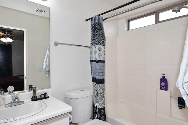 full bathroom featuring vanity, toilet, ceiling fan, and shower / tub combo with curtain