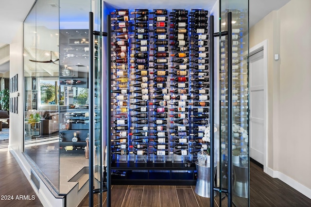 wine room featuring electric panel and hardwood / wood-style flooring