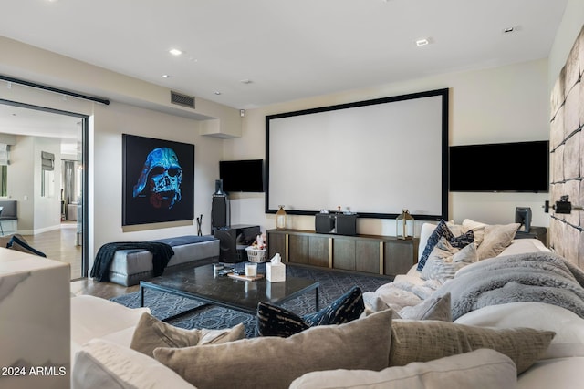 home theater room featuring light hardwood / wood-style floors