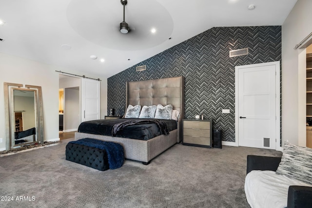 bedroom with a barn door, ceiling fan, carpet, and lofted ceiling