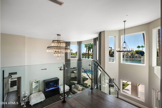 interior space featuring dark hardwood / wood-style floors and a notable chandelier