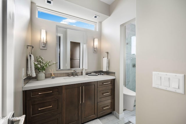 bathroom featuring vanity, toilet, and walk in shower