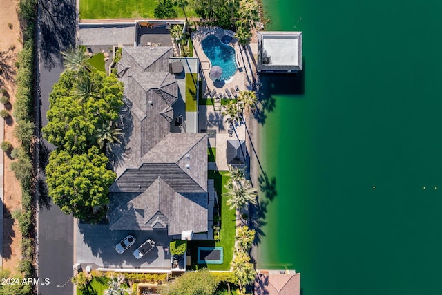 birds eye view of property featuring a water view