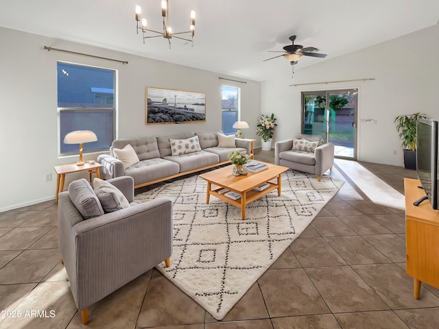 tiled living room featuring ceiling fan with notable chandelier and lofted ceiling