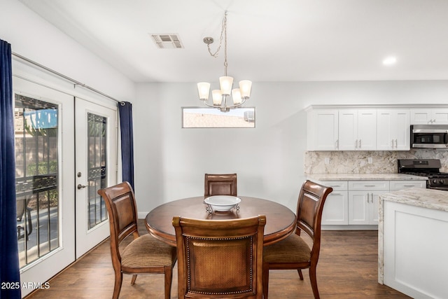 1492 E Westchester Dr, Chandler, AZ 85249 - dining room with french doors, a chandelier, and dark wood-style flooring