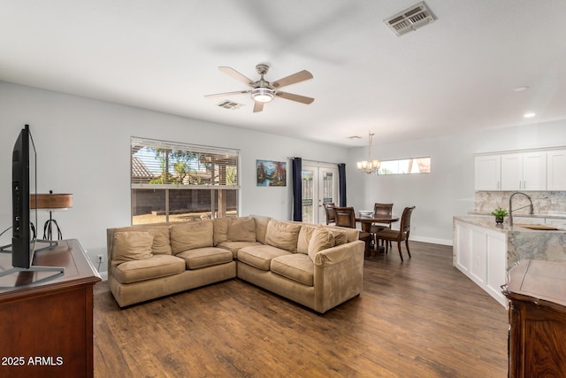1492 E Westchester Dr, Chandler, AZ 85249 - living area with dark wood-style flooring, a ceiling fan, a chandelier, baseboards, and recessed lighting