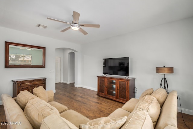 1492 E Westchester Dr, Chandler, AZ 85249 - living room featuring arched walkways, ceiling fan, baseboards, and wood finished floors