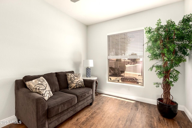 1492 E Westchester Dr, Chandler, AZ 85249 - living area with wood finished floors, baseboards, and ceiling fan