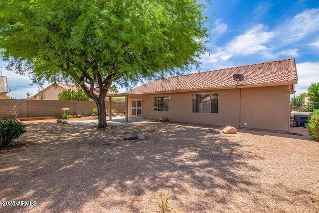 1492 E Westchester Dr, Chandler, AZ 85249 - back of house with fence, a tiled roof, central AC unit, stucco siding, and a patio