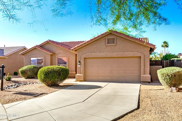 1492 E Westchester Dr, Chandler, AZ 85249 - mediterranean / spanish home featuring a tiled roof, stucco siding, and concrete driveway