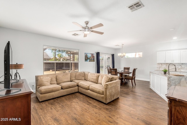 1492 E Westchester Dr, Chandler, AZ 85249 - living area featuring dark wood-type flooring, a ceiling fan, a chandelier, baseboards, and recessed lighting
