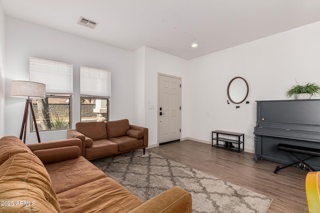 living room with dark hardwood / wood-style flooring