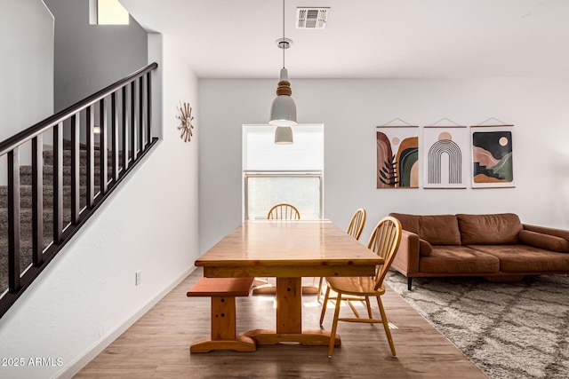 dining space with light wood-type flooring