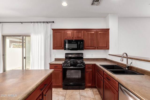 kitchen with sink and black appliances