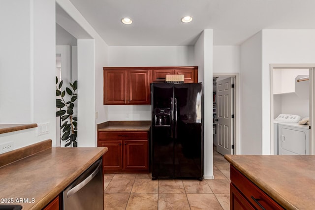 kitchen featuring stainless steel dishwasher, black fridge with ice dispenser, and washer and dryer