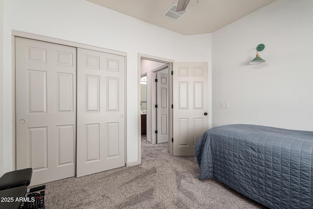 carpeted bedroom with a closet and ceiling fan