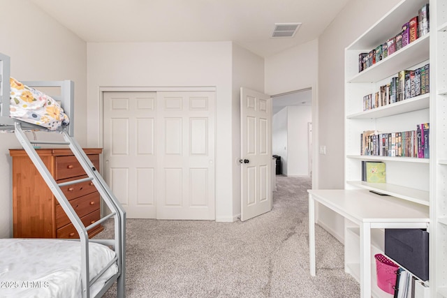 bedroom with a closet and carpet