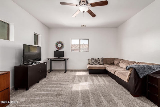 living room featuring ceiling fan and light carpet