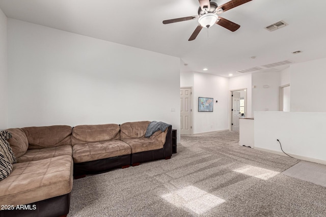 carpeted living room featuring ceiling fan