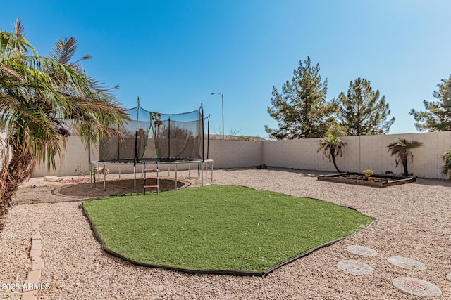 view of yard featuring a trampoline