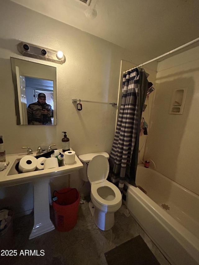 bathroom with toilet and shower / bathtub combination with curtain