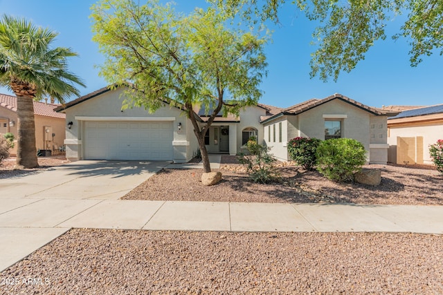 13630 W Redfield Rd, Surprise, AZ 85379 - view of front of property with stucco siding, a garage, driveway, and a tiled roof