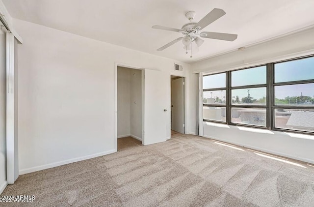 3949 E Earll Dr, Phoenix, AZ 85018 - unfurnished bedroom with carpet floors, baseboards, and a ceiling fan
