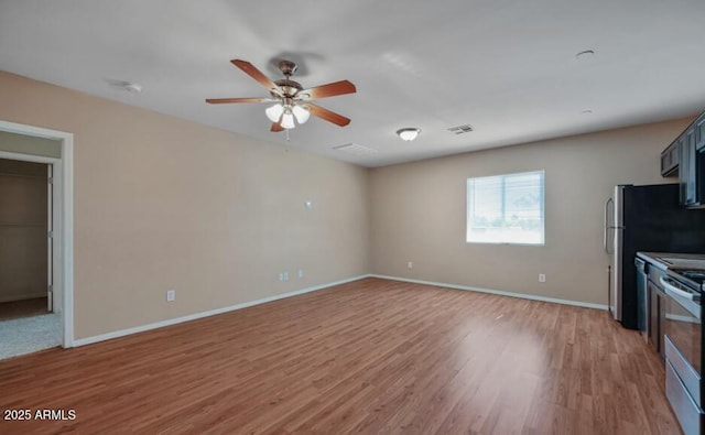 3949 E Earll Dr, Phoenix, AZ 85018 - unfurnished living room with light wood-style flooring, ceiling fan, and baseboards