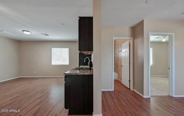 3949 E Earll Dr, Phoenix, AZ 85018 - kitchen with wood finished floors, a sink, baseboards, and ceiling fan