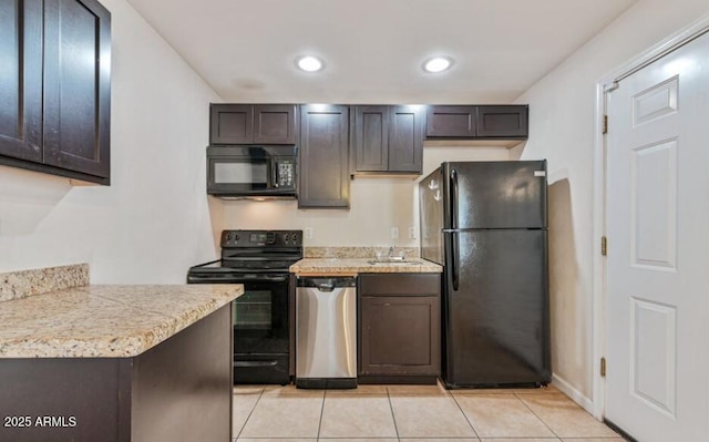 3949 E Earll Dr, Phoenix, AZ 85018 - kitchen featuring black appliances, light countertops, light tile patterned flooring, recessed lighting, and dark brown cabinets