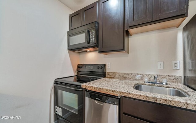 3949 E Earll Dr, Phoenix, AZ 85018 - kitchen featuring black appliances, a sink, dark brown cabinetry, and light stone countertops