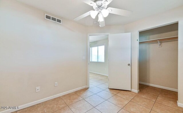 3949 E Earll Dr, Phoenix, AZ 85018 - unfurnished bedroom featuring light tile patterned flooring, a closet, baseboards, and ceiling fan