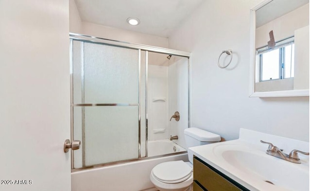 3949 E Earll Dr, Phoenix, AZ 85018 - bathroom featuring vanity, toilet, and enclosed tub / shower combo
