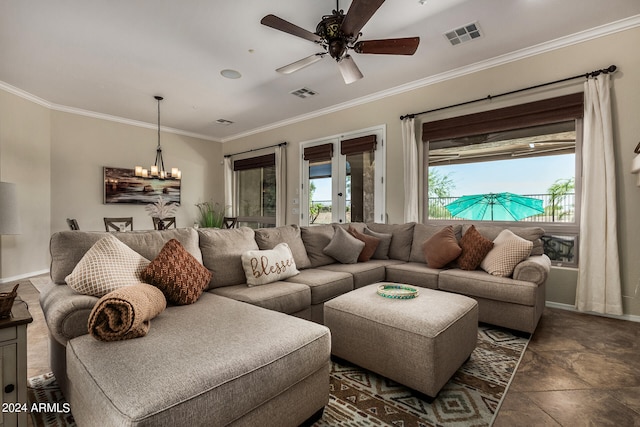 living room with ceiling fan with notable chandelier and crown molding