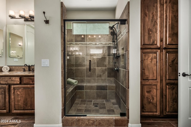 bathroom with vanity and walk in shower