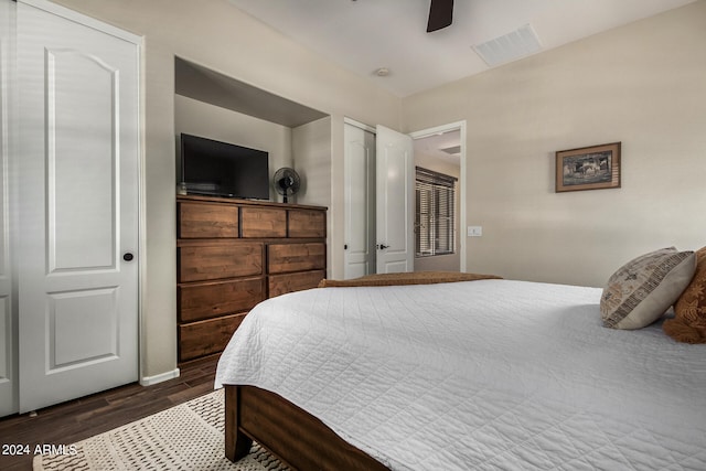 bedroom with ceiling fan and dark wood-type flooring