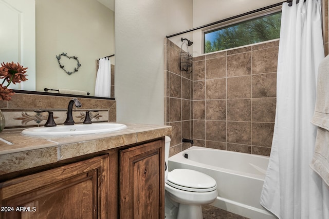 full bathroom with toilet, shower / tub combo, vanity, and tasteful backsplash