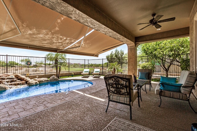 view of pool featuring a patio, ceiling fan, and an outdoor living space