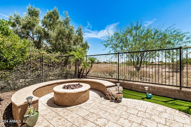 view of patio with an outdoor fire pit