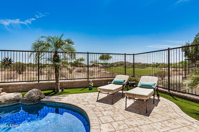 view of patio / terrace featuring a fenced in pool