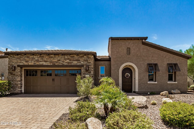 view of front of property with a garage