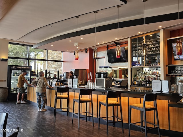 bar featuring floor to ceiling windows and dark hardwood / wood-style floors