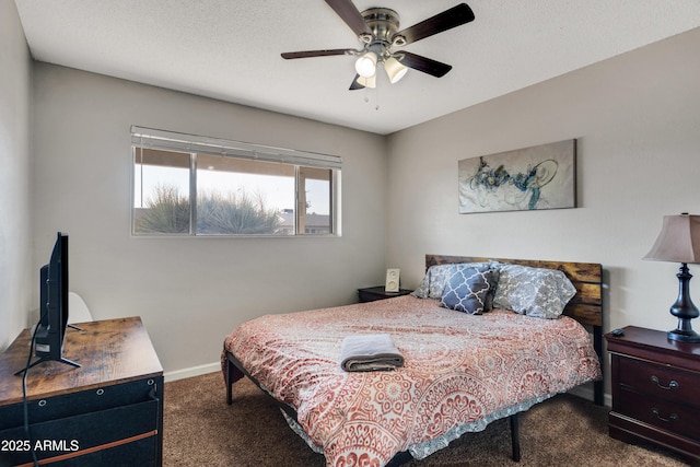 7520 E Papago Dr, Scottsdale, AZ 85257 - bedroom featuring a ceiling fan, baseboards, dark colored carpet, and a textured ceiling