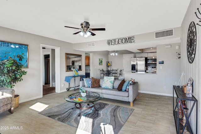 7520 E Papago Dr, Scottsdale, AZ 85257 - living room with baseboards, visible vents, and a ceiling fan