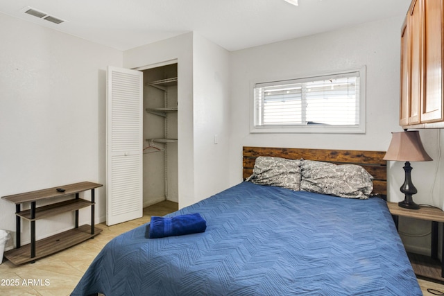 7520 E Papago Dr, Scottsdale, AZ 85257 - bedroom featuring a closet, visible vents, and light tile patterned flooring