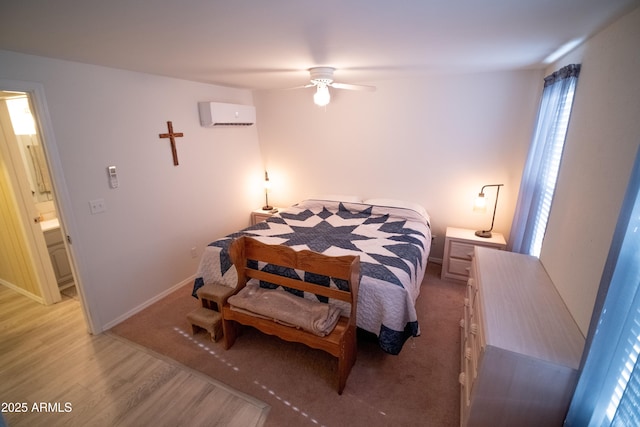 7411 N Toya Vista Rd, Payson, AZ 85541 - bedroom with a wall unit AC, light wood-style floors, and baseboards