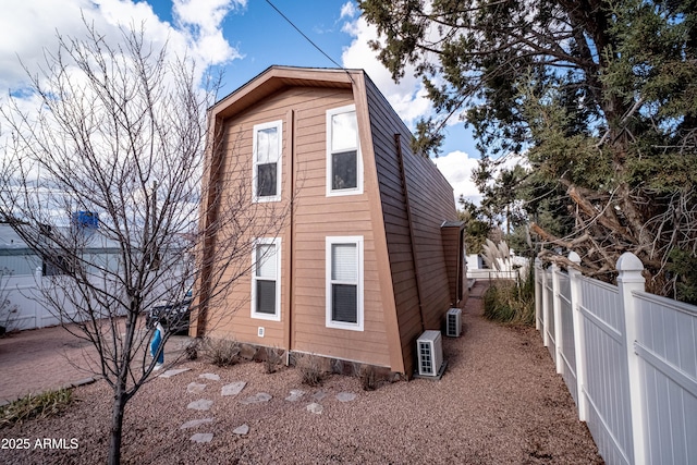 7411 N Toya Vista Rd, Payson, AZ 85541 - view of side of home with fence, a cooling unit, and cooling unit
