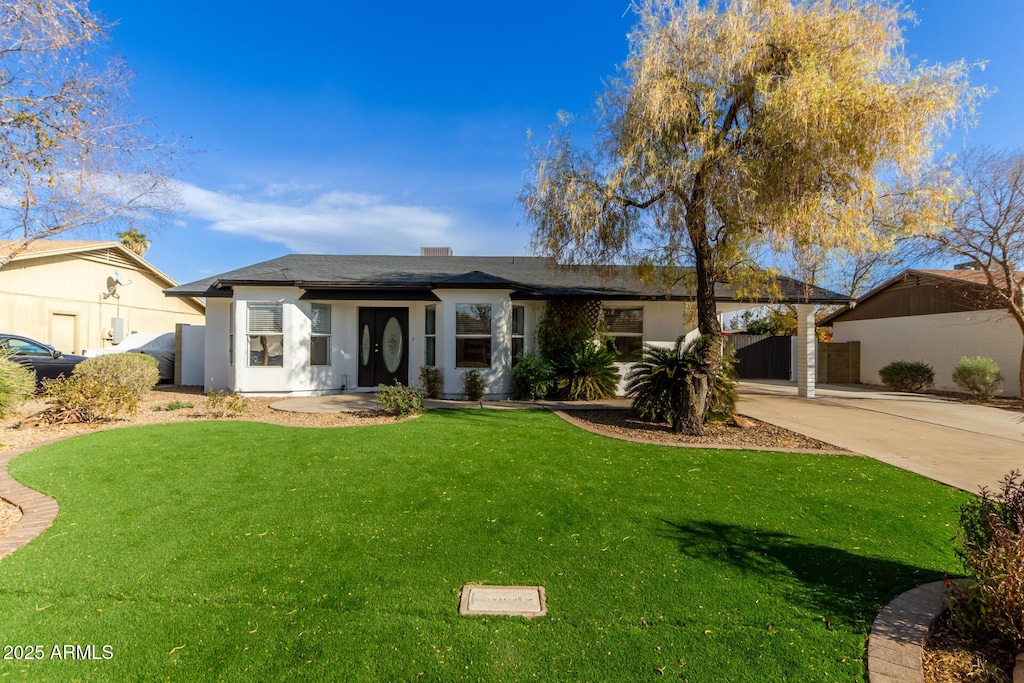 ranch-style home with a front yard