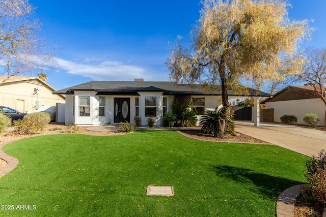 ranch-style home with a front yard